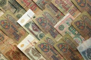Old Russian money banknotes texture. Rubles cash filling background. Soviet wealth financial backdrop. Earning pattern. photo