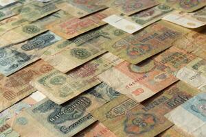 Old Russian money banknotes texture. Rubles cash filling background. Soviet wealth financial backdrop. Earning pattern. photo