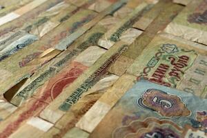 Old Russian money banknotes texture. Rubles cash filling background. Soviet wealth financial backdrop. Earning pattern. photo