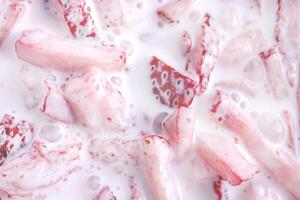 Fresh vitamin berry backdrop. Cream in sliced strawberry filling background. Plum with red healthy tasty strawberry texture. photo