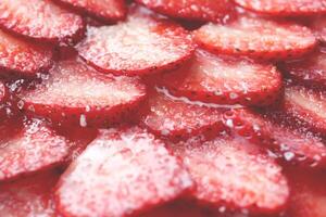 Red healthy tasty strawberry with sugar plum texture. Fresh vitamin berry backdrop. Sliced strawberry in sugar cream filling background. photo