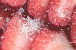 Red healthy tasty strawberry with sugar texture. Fresh vitamin berry backdrop. Sliced strawberry in sugar filling background. photo