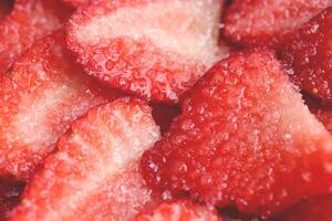 Red healthy tasty strawberry with sugar texture. Fresh vitamin berry backdrop. Sliced strawberry in sugar filling background. photo