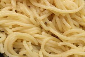 Macaroni background. Cooked pasta. Filling spaghetti texture. photo