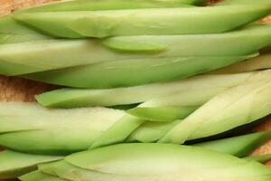 Fresh health avocado slices. Filling background. Macro closeup. photo