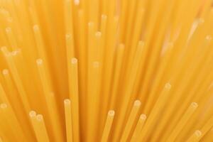 Pasta filling background. Spaghetti bunch texture. Macaroni backdrop. photo