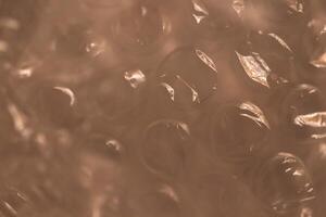 Air pimples plastic background. Protective cellophane with bubbles texture. photo