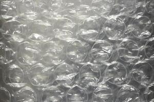 Protective cellophane with bubbles texture. Air pimples plastic background. photo