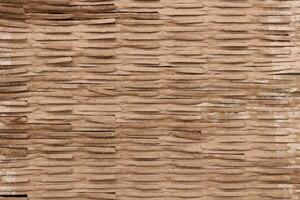 Corrugated cardboard filling background. Ribbed carton texture. Fluted paper backdrop. photo