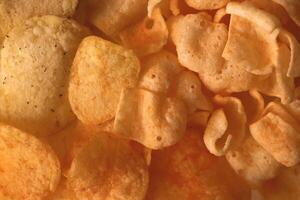 Chips texture. Crisps filling background. photo