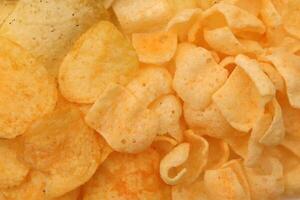 Chips texture. Crisps filling background. photo