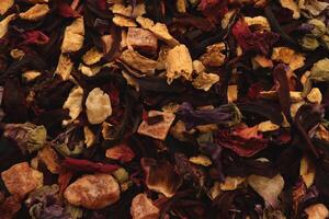 Many dry flowers background. Lot of dry red petals texture. Scattered tea pattern. photo