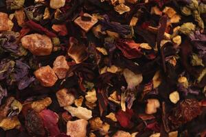 Many dry flowers background. Lot of dry red petals texture. Scattered tea pattern. photo