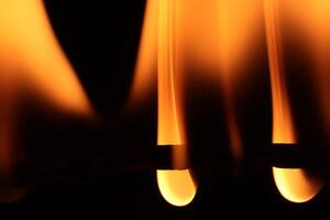 Glowing dangerous burl light backdrop. Danger blazing flame. Burning flames background. Blaze fire texture. photo