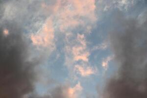 Nature heaven atmosphere texture. Massive clouds on the blue sky background. photo