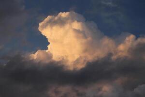 Massive clouds on the blue sky background. Nature heaven atmosphere texture. photo