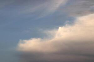 Cloudscape altocumulus lenticularis blue sky sunlight texture. photo