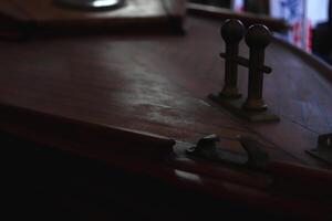 Duck for mooring on the deck of a varnished yacht. Marine background. photo