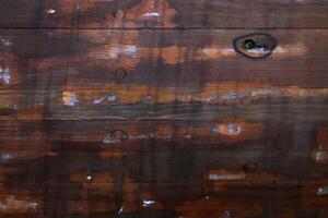 Board repairing background. Weathered dark wood texture. photo