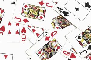 mezclado jugando tarjetas antecedentes. clasificado jugar tarjetas fondo. muchos diverso revoltijado jugando tarjetas superficie. foto
