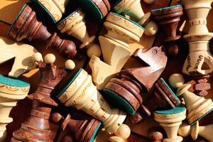 A lot of chess figures lies on a chess board. Wood game chessboard background. photo