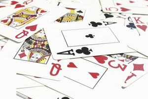 Mixed playing cards background. Assorted play cards backdrop. Many miscellaneous jumbled playing cards surface. photo