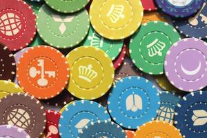 Lot multicolor assorted gambling playing chips surface. Colorful casino chips background. Many colored chips backdrop. photo