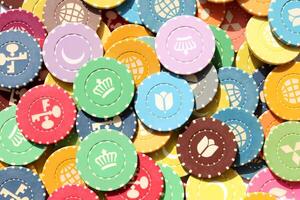 Lot multicolor assorted gambling playing chips surface. Colorful casino chips background. Many colored chips backdrop. photo