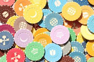 Many colored chips backdrop. Lot multicolor assorted gambling playing chips surface. Colorful casino chips background. photo