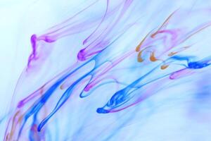 Colored Falling Ink Drops in Water. Abstract Fantasy Background. photo