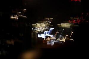 Night exposure zoom traces background. Light lines leaks exposition backdrop. Night city rays glow texture. photo