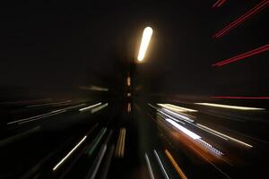 Night city sky rays glow background. Night exposure zoom traces backdrop. Light lines leaks exposition texture. photo