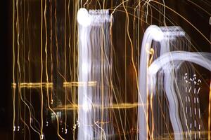 Light lines leaks exposition background. Night city rays glow backdrop. Night exposure zoom traces texture. photo