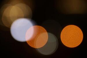 Blurred lights background. Lens bokeh backdrop. Flare lights overlays. Abstract bright blurred colored bokeh. photo