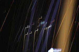 Light lines leaks exposition background. Night city rays glow backdrop. Night exposure zoom traces texture. photo