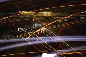 Light lines leaks exposition background. Night city rays glow backdrop. Night exposure zoom traces texture. photo