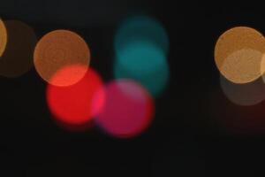 Abstract bright blurred colored bokeh. Blurred colored lights background. Lens bokeh backdrop. Flare color lights overlays. photo
