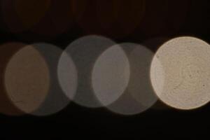 Blurred colored lights background. Lens bokeh backdrop. Flare color lights overlays. Abstract bright blurred colored bokeh. photo