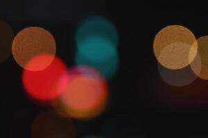 Blurred colored lights background. Lens bokeh backdrop. Flare color lights overlays. Abstract bright blurred colored bokeh. photo