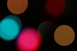 Lens bokeh backdrop. Flare color lights overlays. Abstract bright blurred colored bokeh. Blurred colored lights background. photo