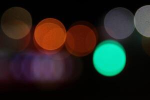 Abstract bright blurred colored bokeh. Blurred colored lights background. Lens bokeh backdrop. Flare color lights overlays. photo