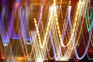 Night exposure zoom traces background. Light lines leaks exposition backdrop. Night city rays glow texture. photo