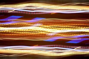 Night exposure zoom traces background. Light lines leaks exposition backdrop. Night city rays glow texture. photo