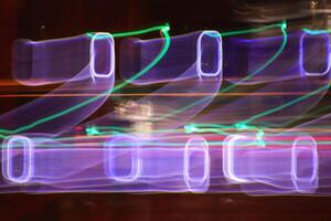 Light lines leaks exposition background. Night city rays glow backdrop. Night exposure zoom traces texture. photo