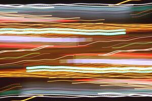 Light lines leaks exposition background. Night city rays glow backdrop. Night exposure zoom traces texture. photo