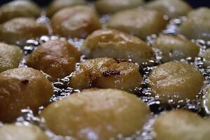 Fried in hot oil shrimp pancake snacks. Healthy organic food backdrop. Natural tasty snack. photo