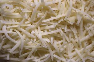 Grated cheese background. Healthy organic food backdrop. Natural tasty snack. photo