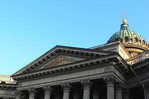 Facade of Kazan Cathedral. Saint-Petersburg. In the center is a silhouette of a shining pyramid. photo