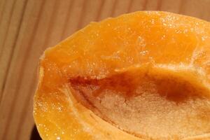 Slice of juicy apricot. Delicious background. Macro closeup. photo