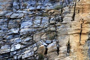 Layered rock texture. Mountain stone pattern background. photo